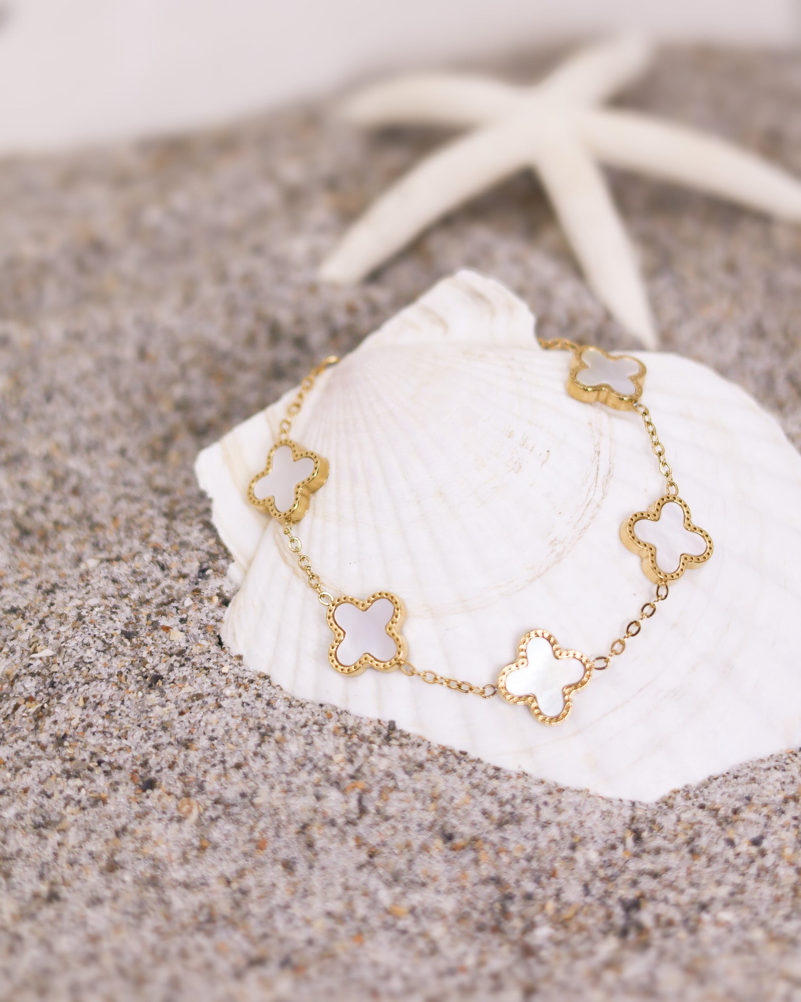 Golden White Clover Bracelet with extension chain and lucky charm details