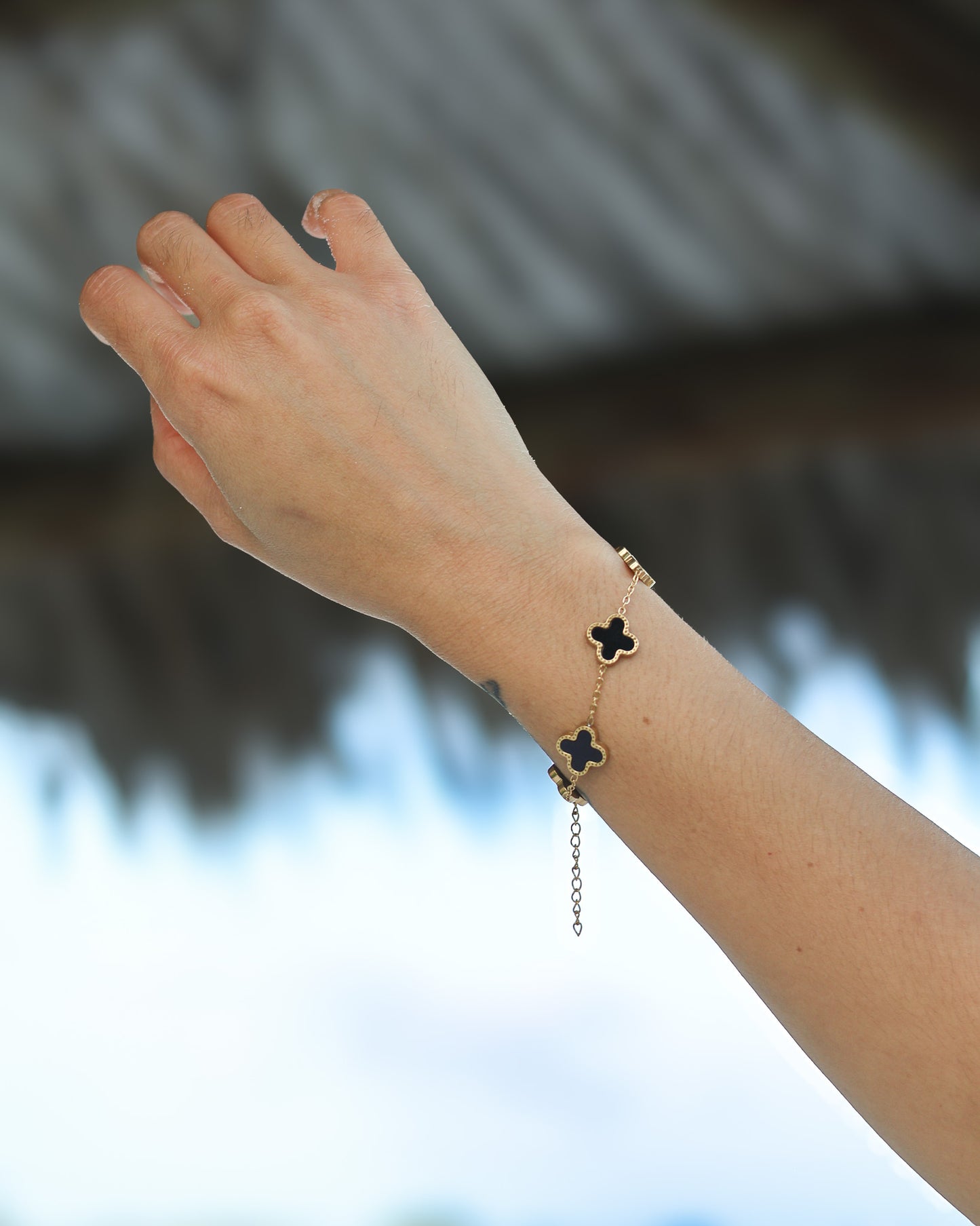 Night-inspired clover bracelet with polished shine and modern boldness